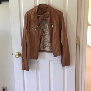 Tan leather jacket.